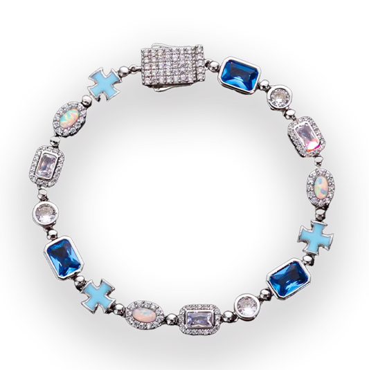 Four beaded stretch bracelets arranged in a 2x2 grid on a white background. The top-left bracelet is gold with blue and white beads, the top-right is silver with blue and white beads, the bottom-left is gold with blue and white beads, and the bottom-right is silver with blue, purple, and white beads.